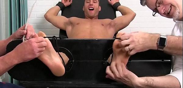  Restrained jock tickled and played with by his horny friends